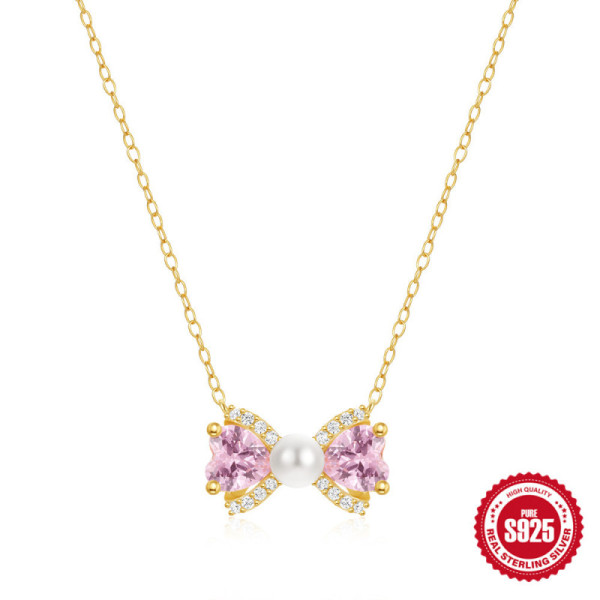 Gold Bow Pendant Necklace with Pink Stones